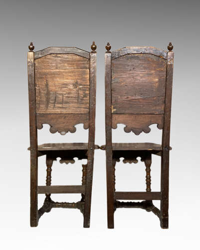 Pair of early continental walnut side chairs.